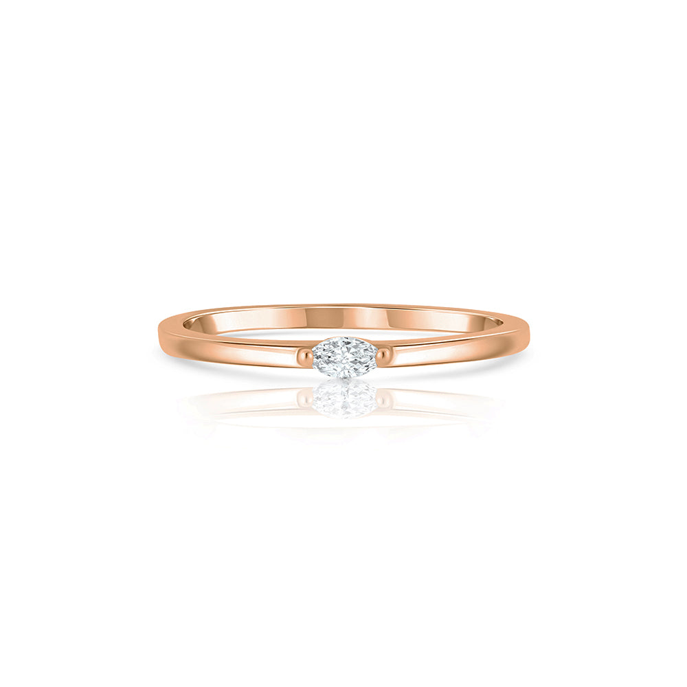 Fine gold ring set with a small marquise-cut lab diamond
