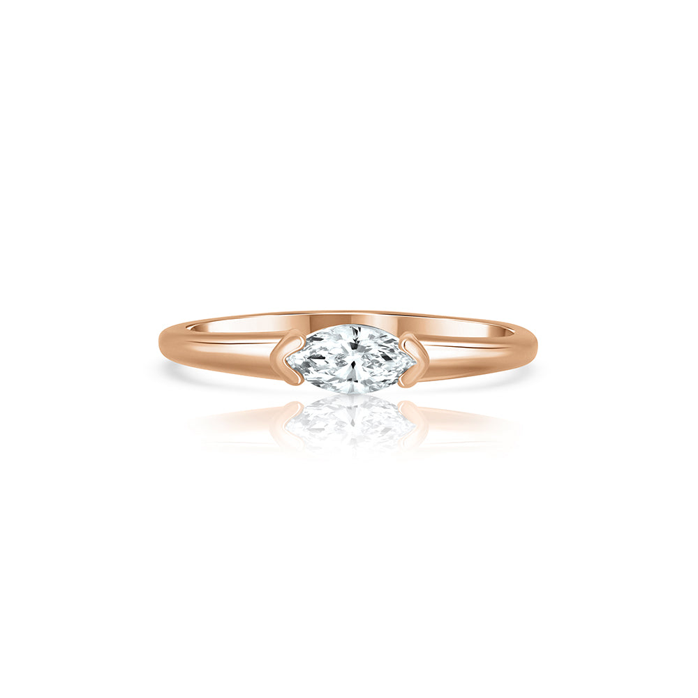 Fine gold ring set with a marquise-cut laboratory diamond