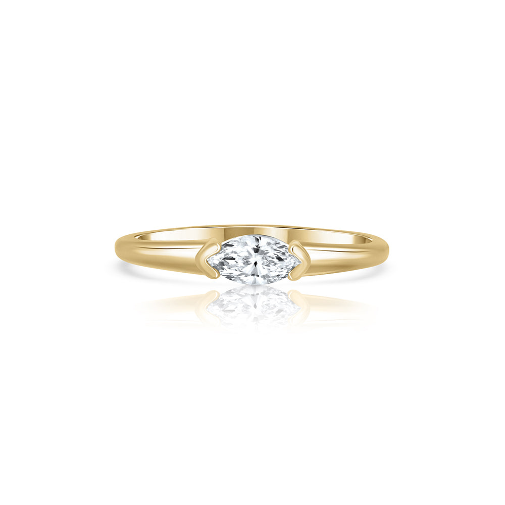 Fine gold ring set with a marquise-cut laboratory diamond