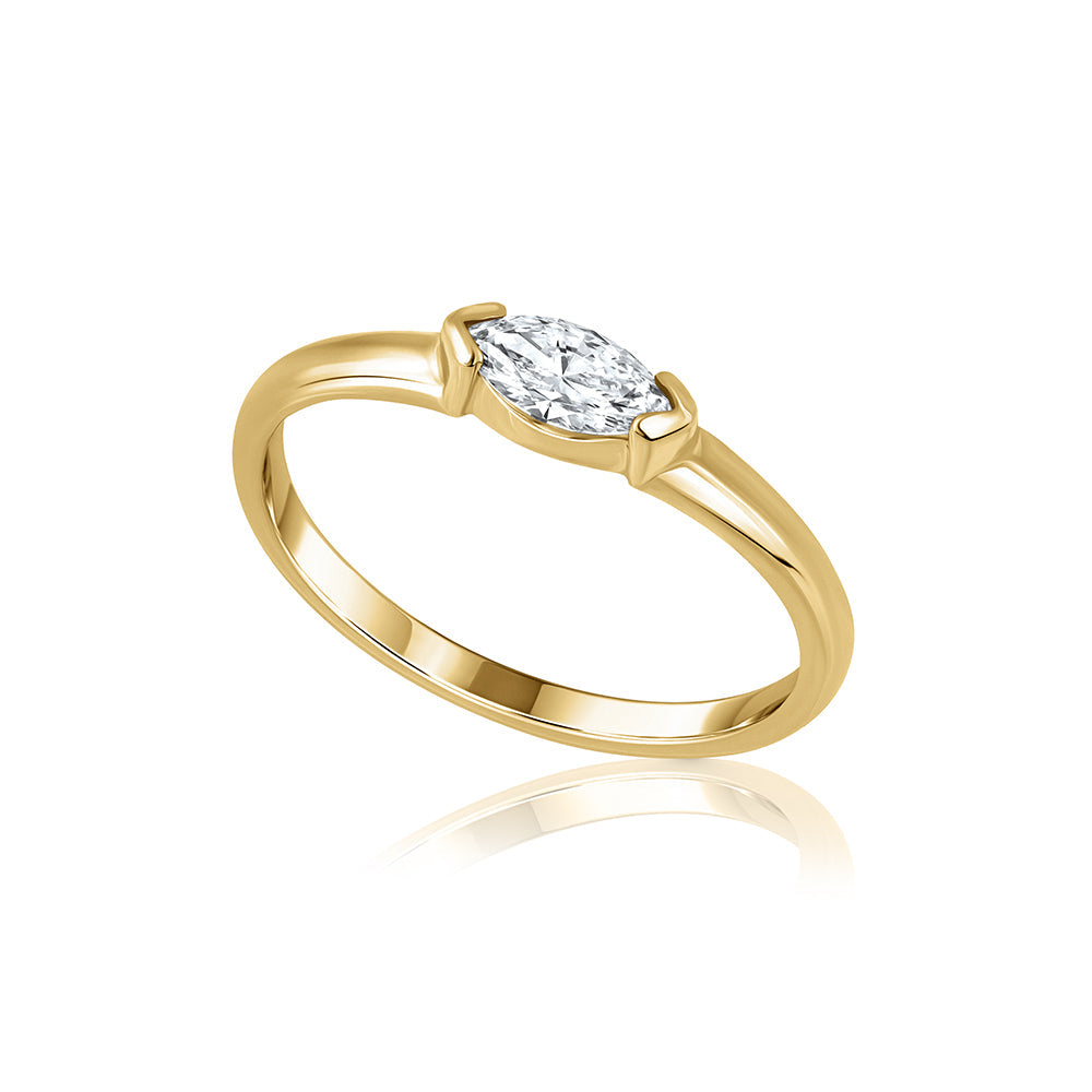 Fine gold ring set with a marquise-cut laboratory diamond