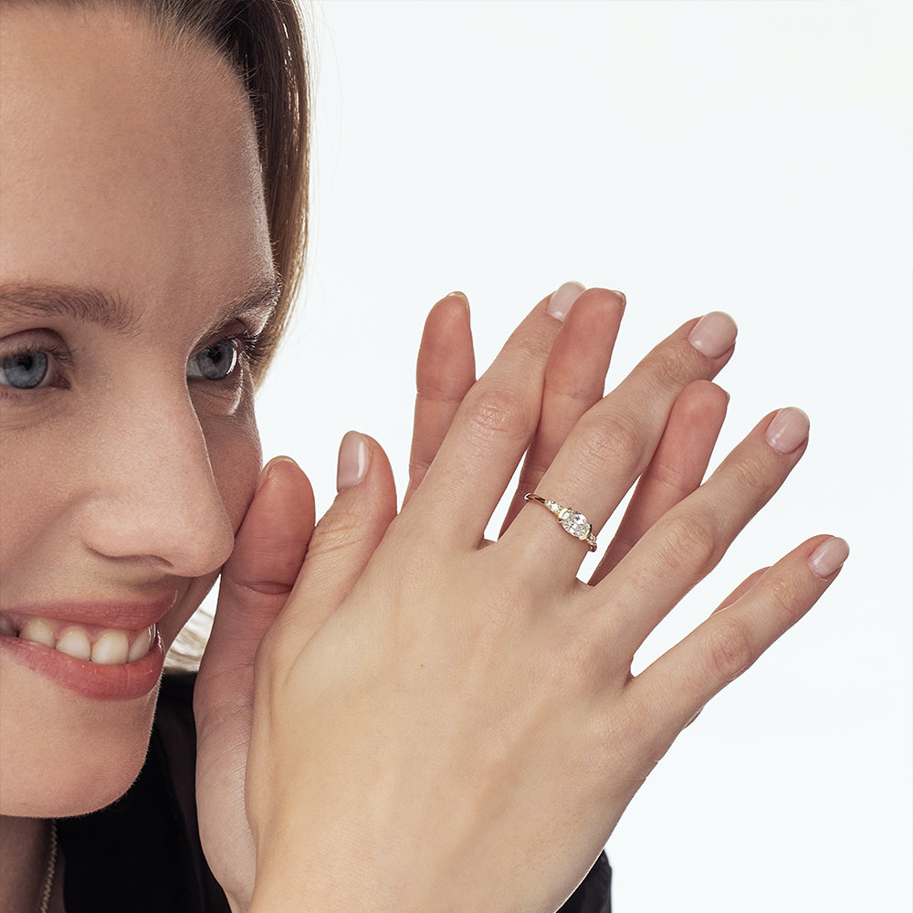 A unique engagement ring set with a laboratory diamond in a horizontal oval cut