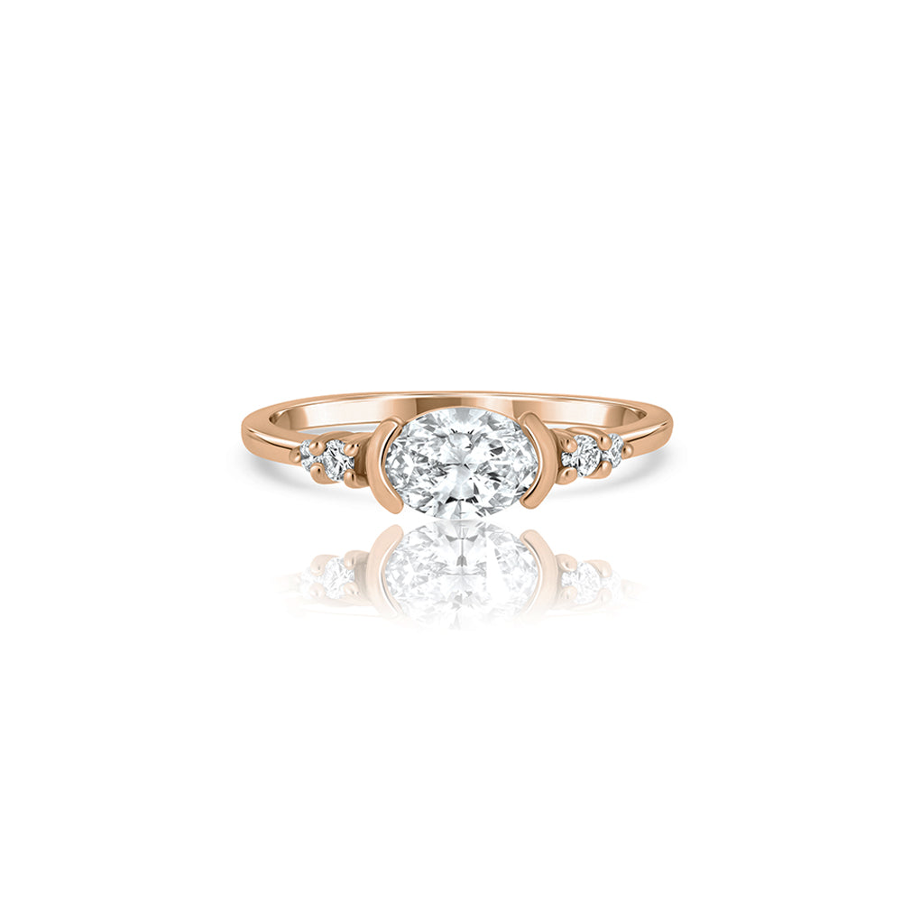 A unique engagement ring set with a laboratory diamond in a horizontal oval cut