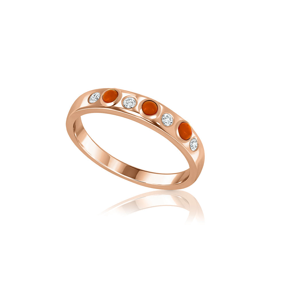 A special gold ring set with natural coral and laboratory diamonds