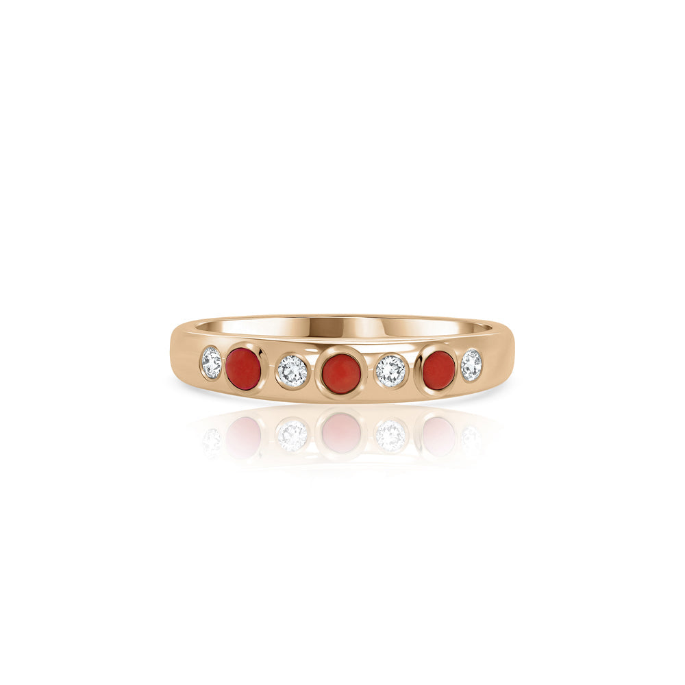 A special gold ring set with natural coral and laboratory diamonds