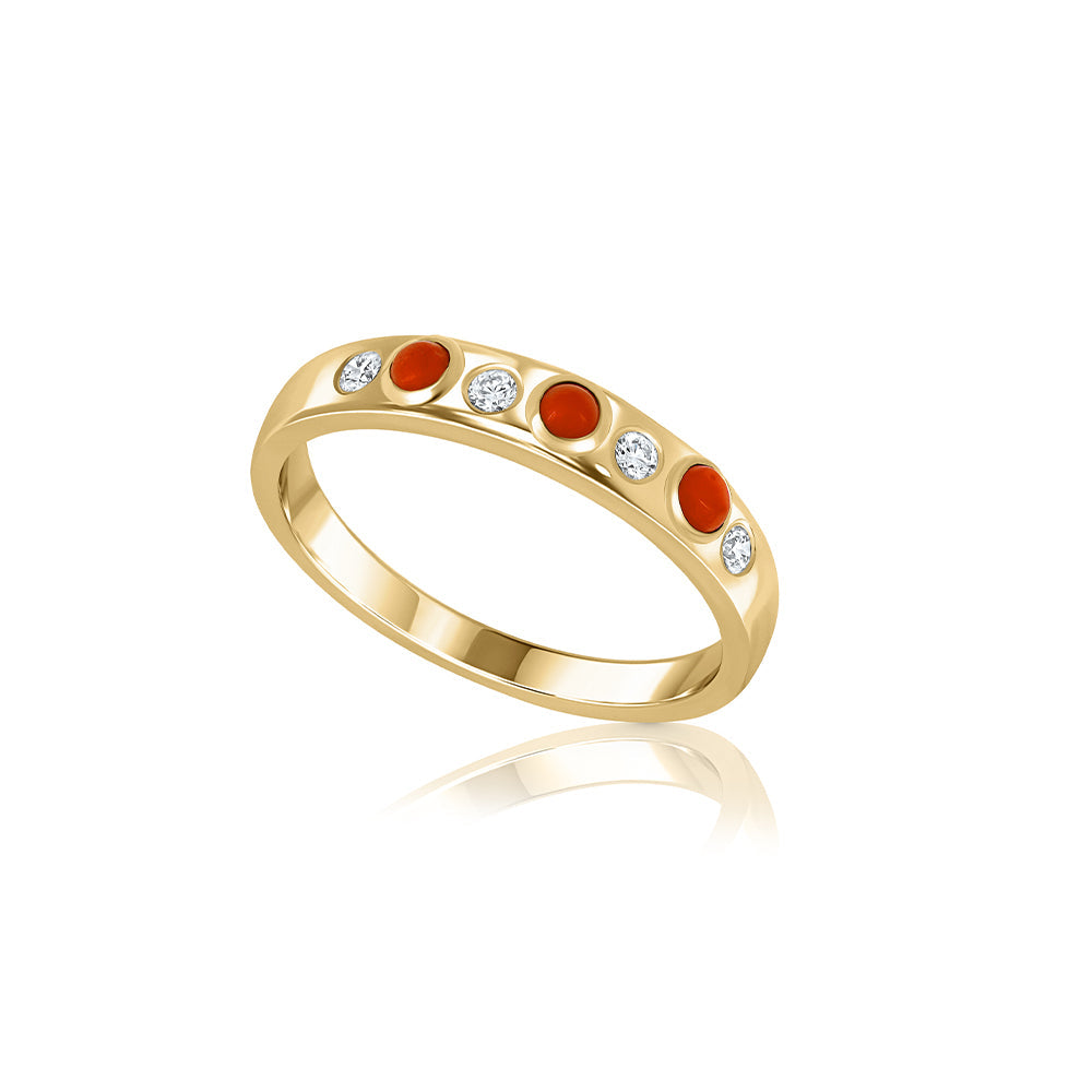 A special gold ring set with natural coral and laboratory diamonds