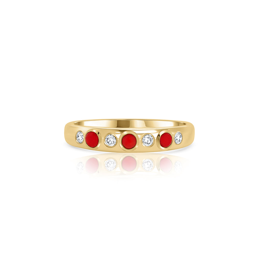 A special gold ring set with natural coral and laboratory diamonds