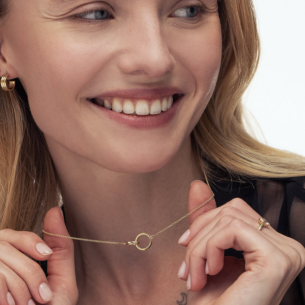 Gold necklace with pendant combined loops