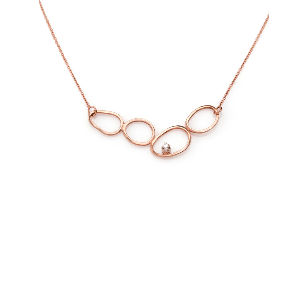 A special gold chain designed from 4 amorphous circles and a diamond