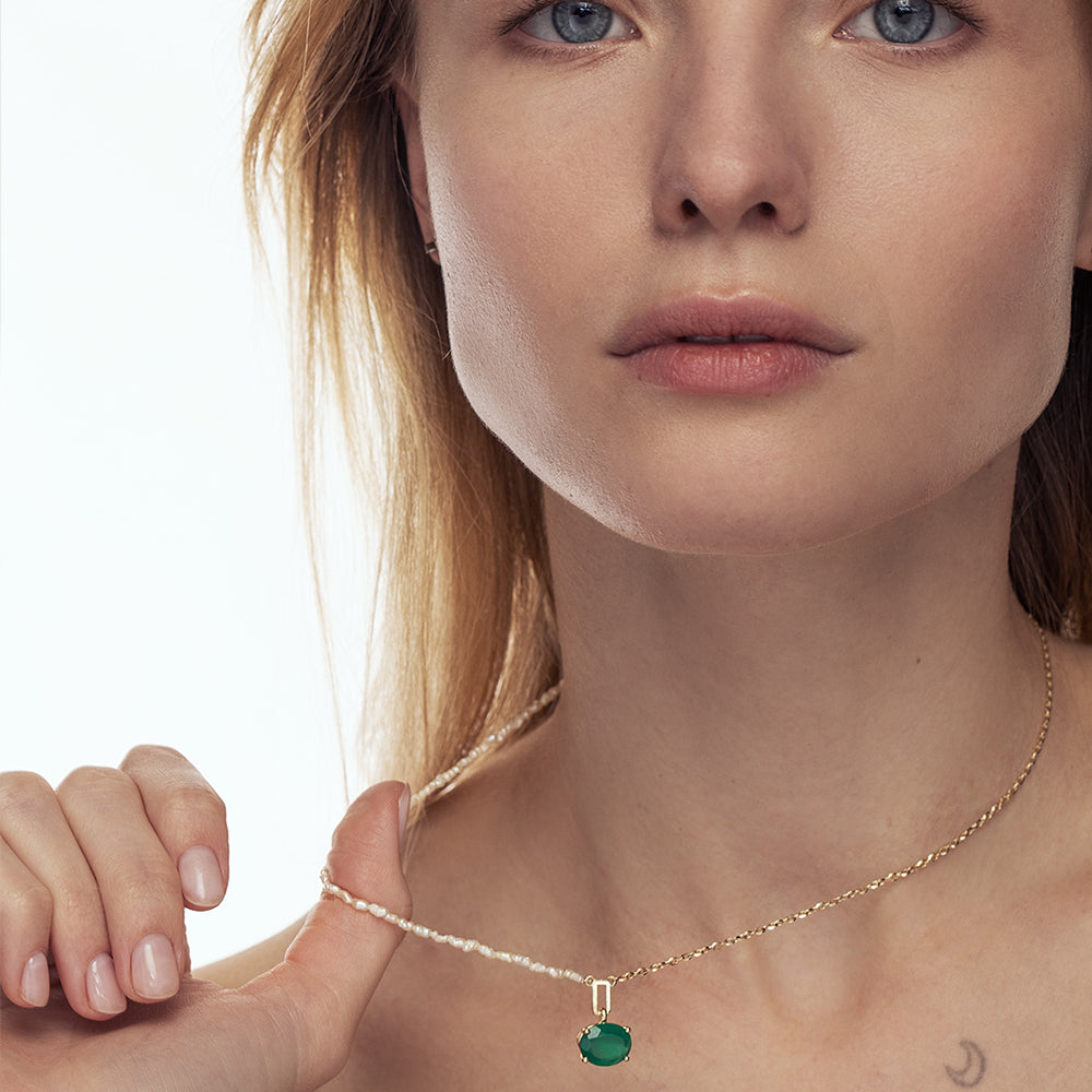 Gold necklace with mother of pearl and oval green onyx