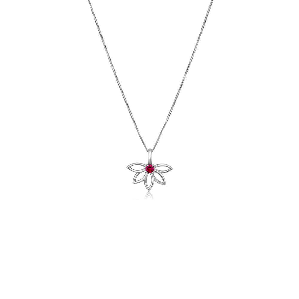 A gold necklace with a flower design, delicate, studded with rubies
