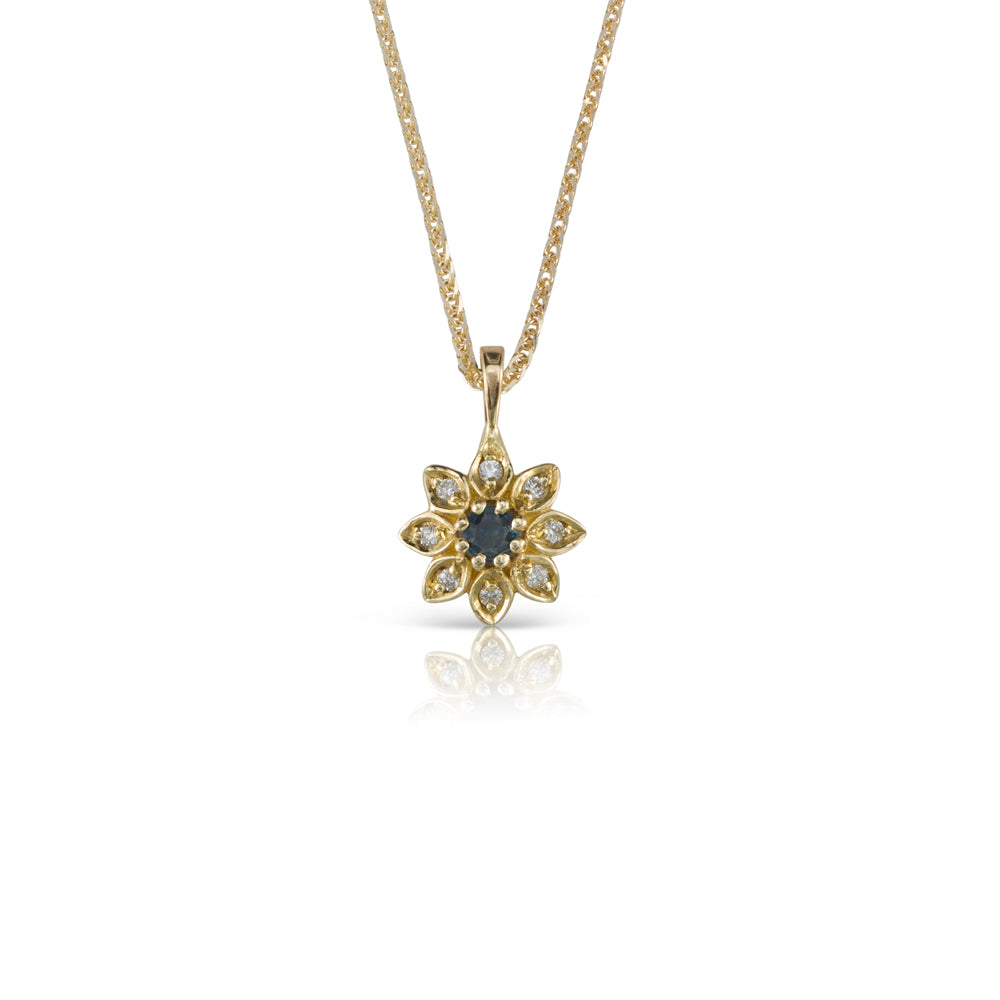 Gold necklace with a flower studded with diamonds and sapphires