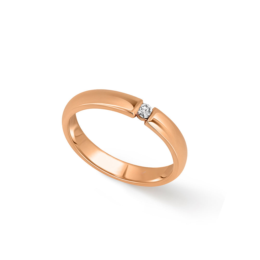 A gold ring set with a round diamond weighing 5 points
