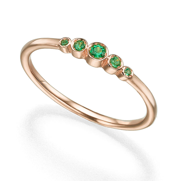 A delicate emerald ring