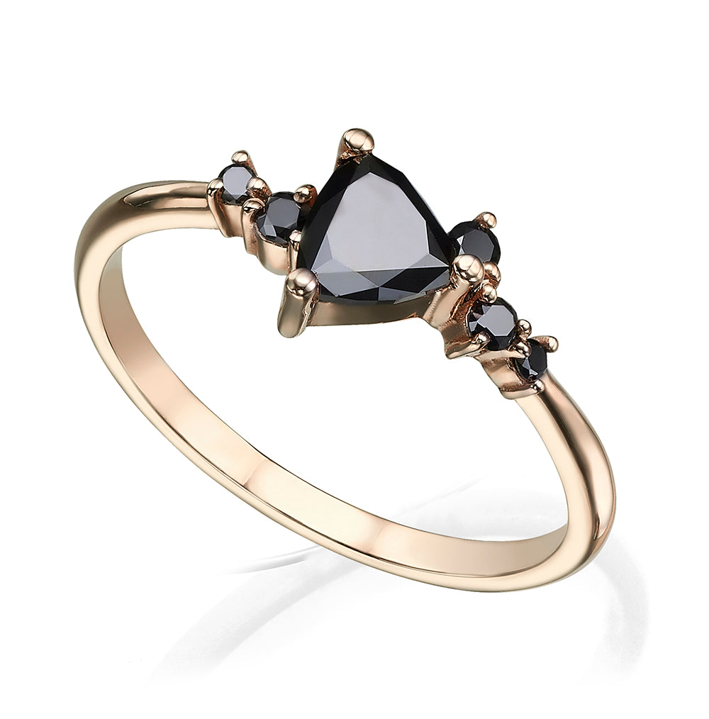An engagement ring set with a trillion-cut black diamond and black diamonds all around
