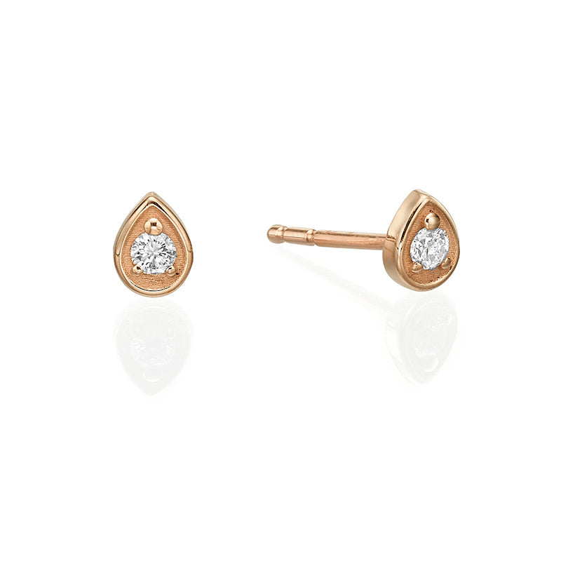 Small attached round diamond earrings in a drop frame