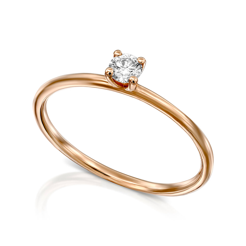 Delicate engagement ring set with a round diamond 15 points round profile