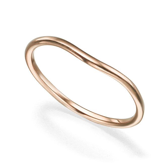 A gold ring with a gentle wave