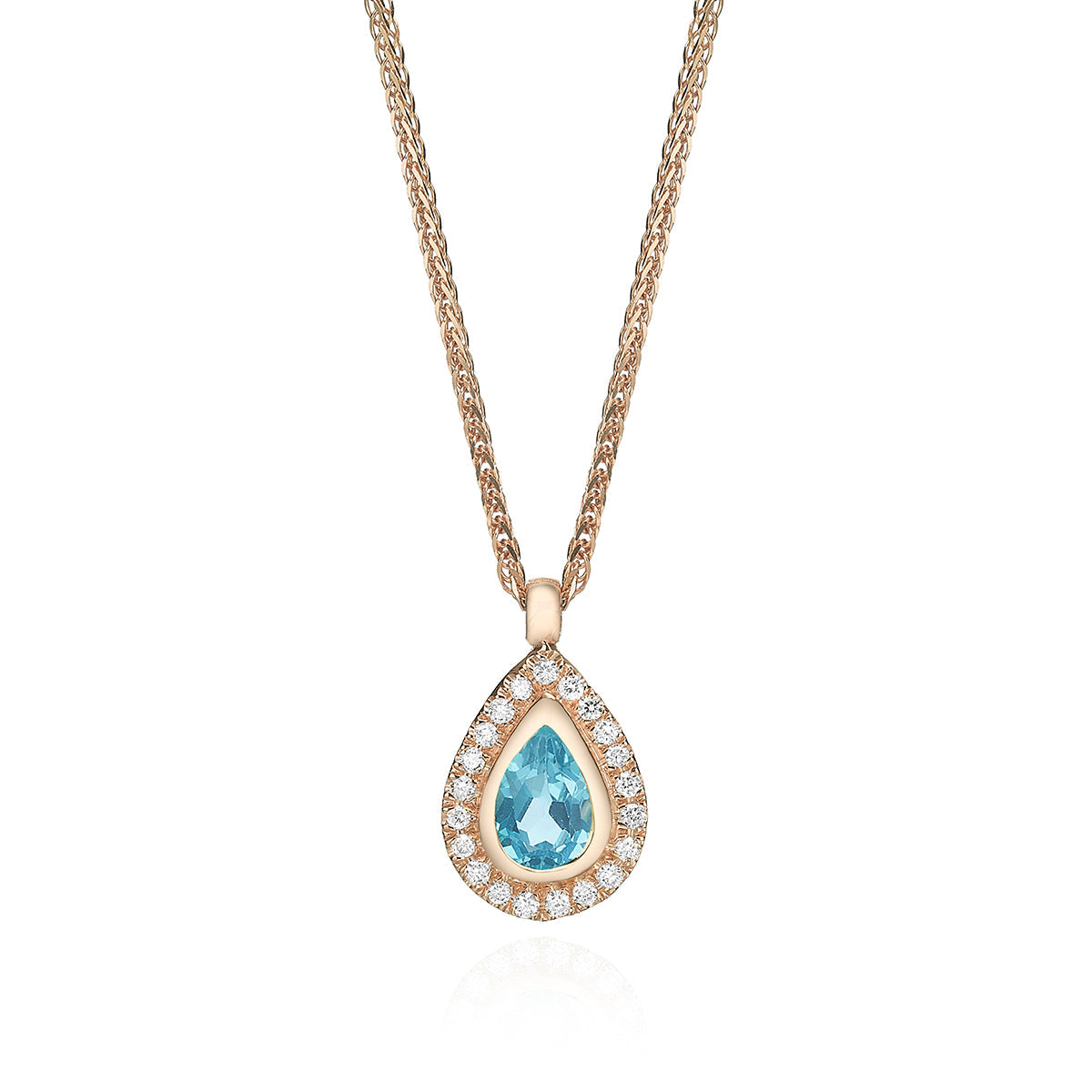 A classic gold chain, a pendant inlaid with blue topaz in the shape of a drop and diamonds all around