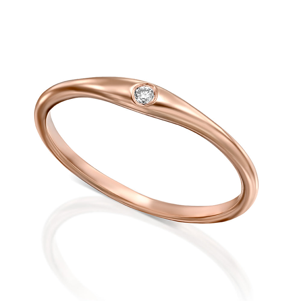 Fine gold ring with a single diamond setting