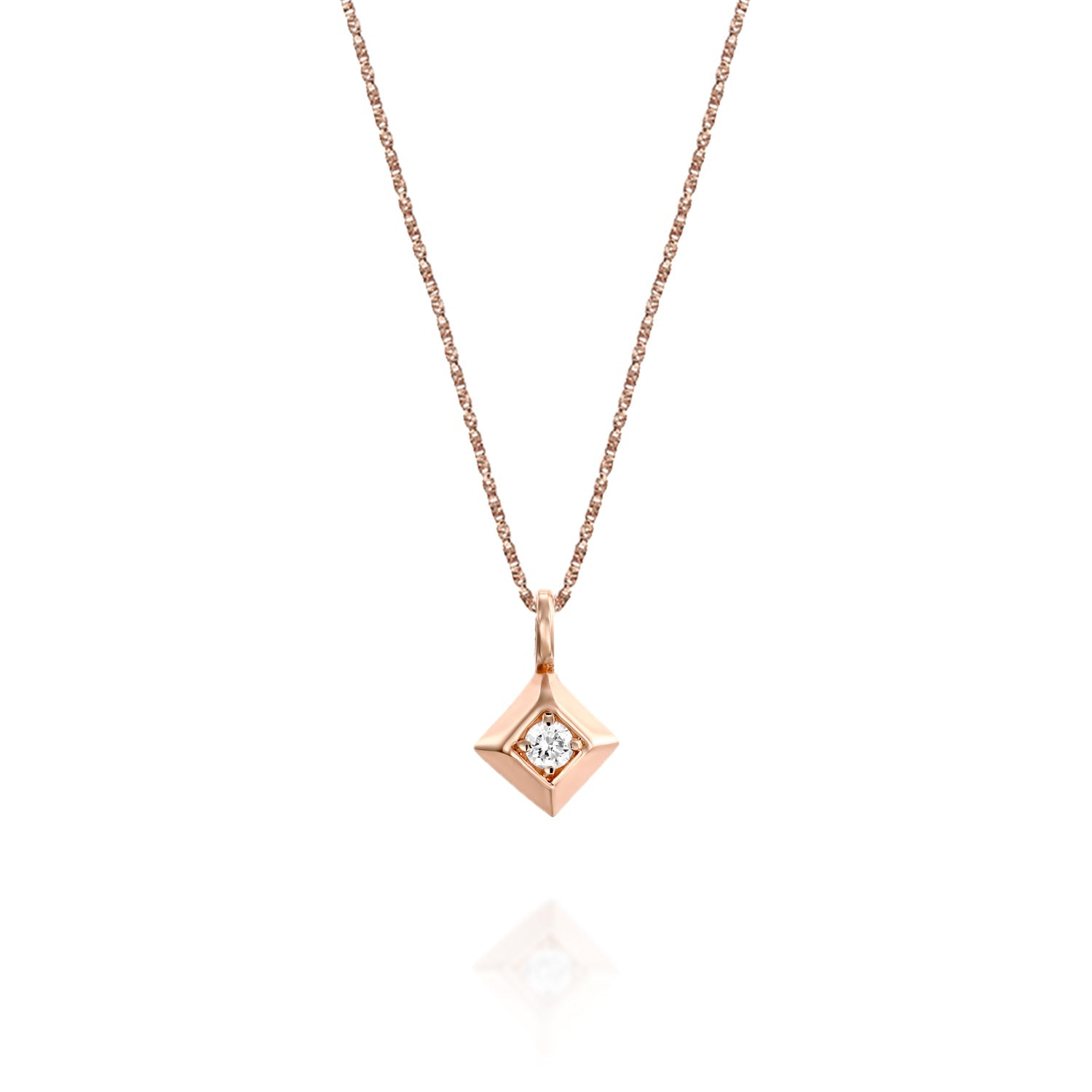 A delicate gold chain with a large square pendant and a 4-point diamond in the center