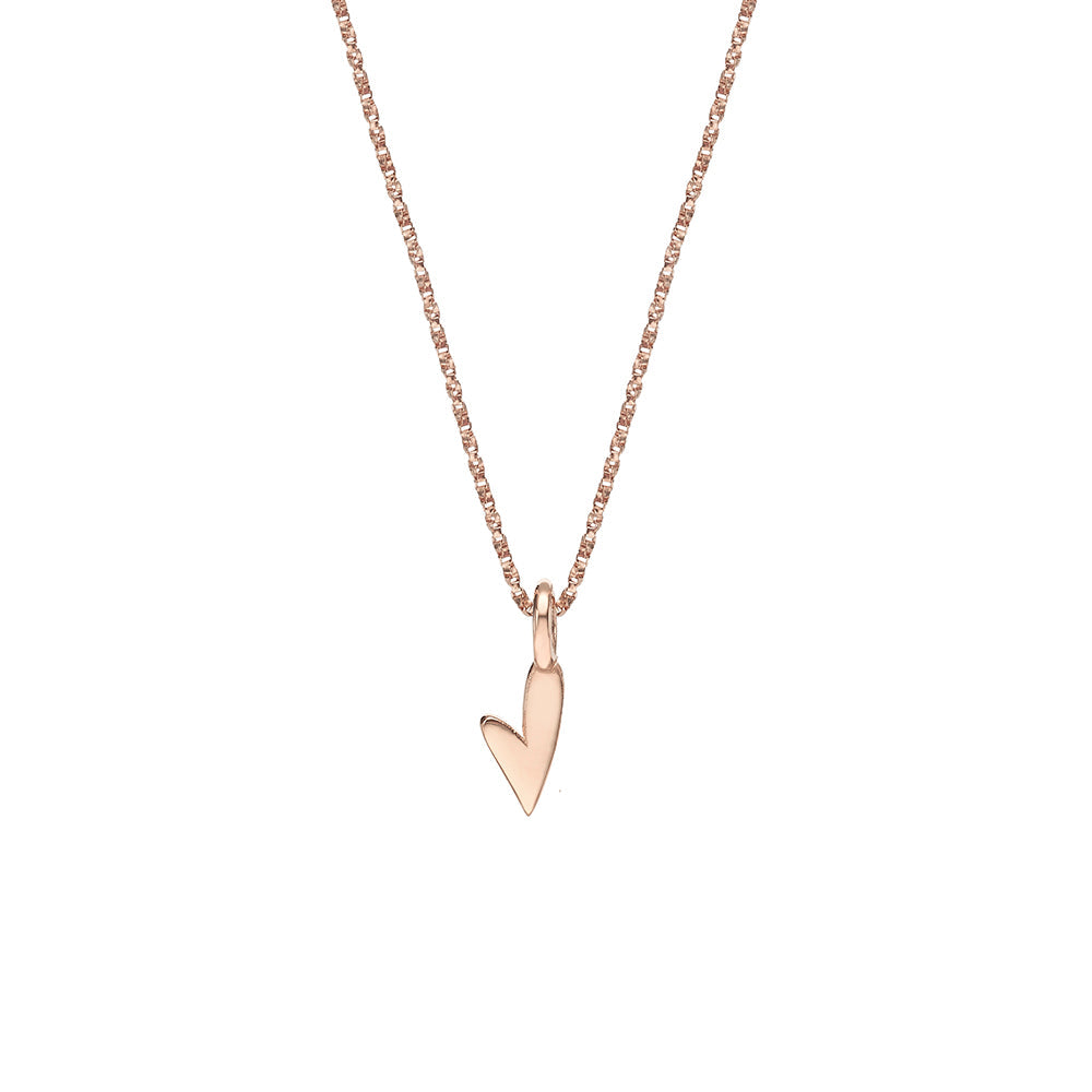 Delicate gold necklace with a heart pendant