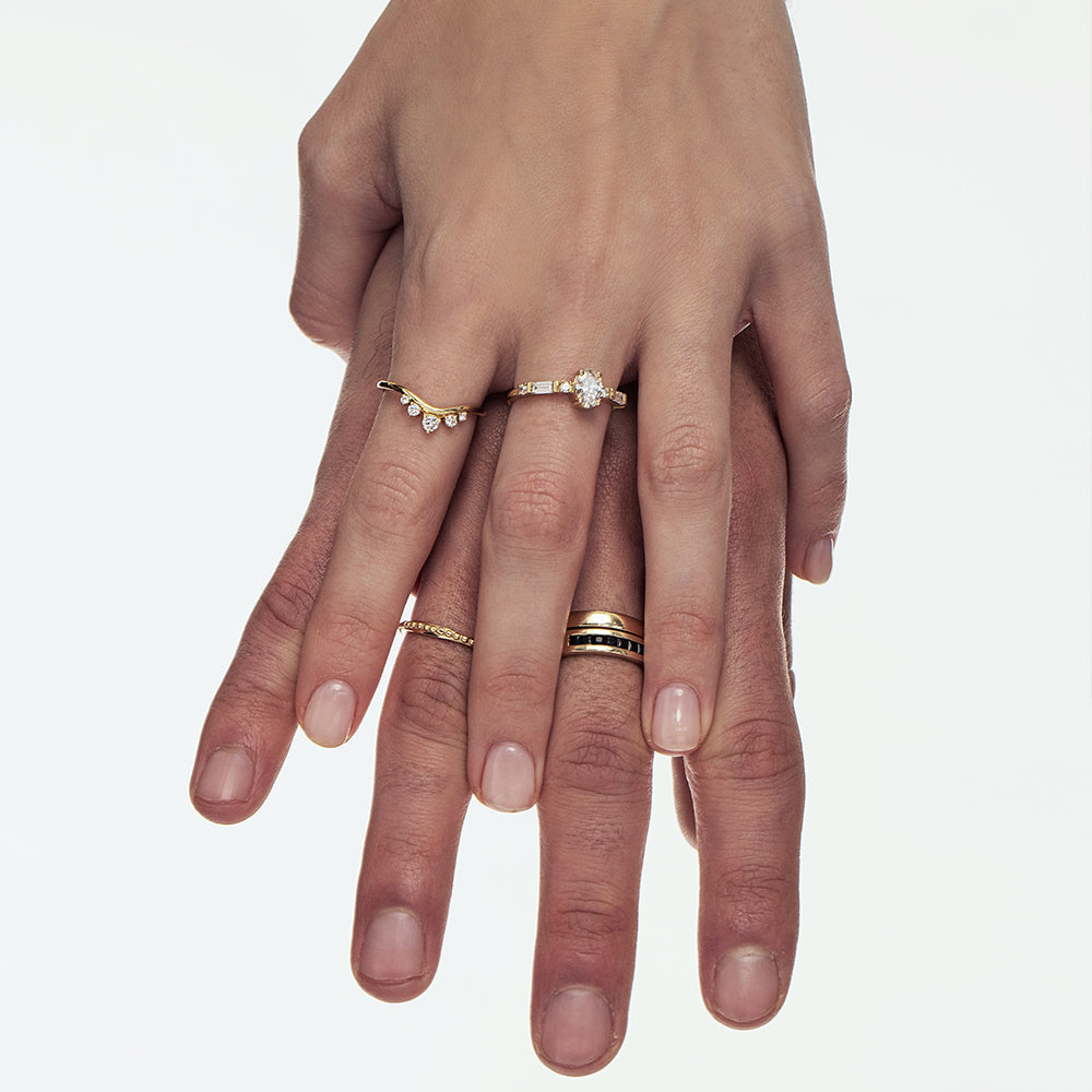 Asymmetric wedding ring decorated with a gold ball