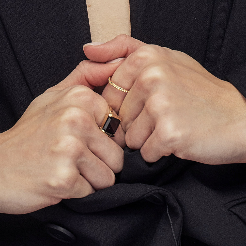 Asymmetric wedding ring decorated with a gold ball