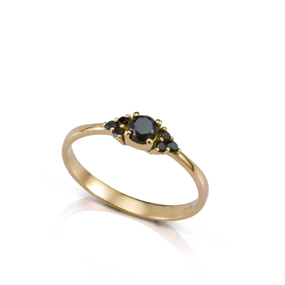 An engagement ring set with a central black diamond and 6 black diamonds on the sides