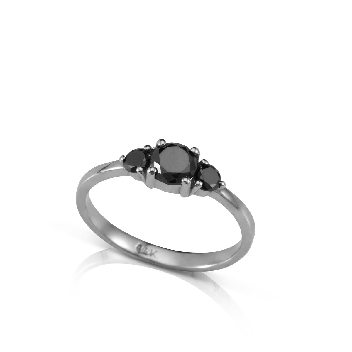 Engagement ring set with a central black diamond and black diamonds on the sides