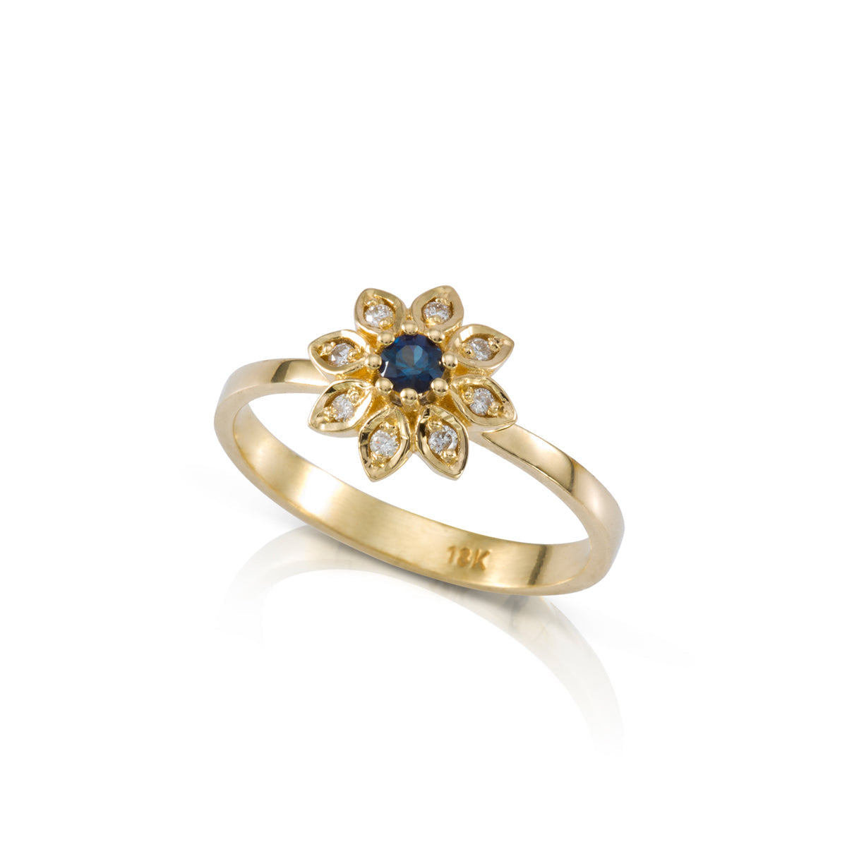 Gold flower ring set with blue sapphire and diamonds