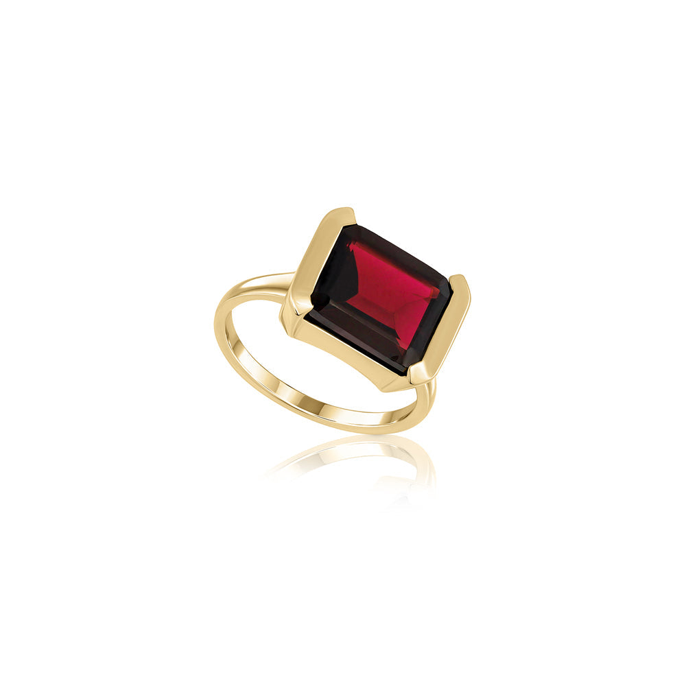 An impressive emerald cut garnet ring