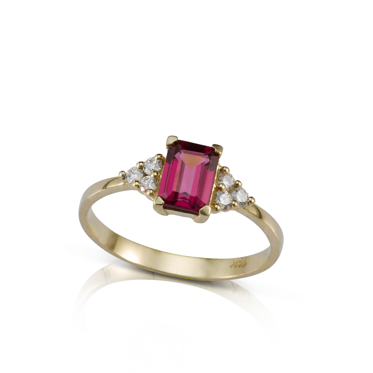 An engagement ring set with a rectangular rhodolite and 6 sided diamonds