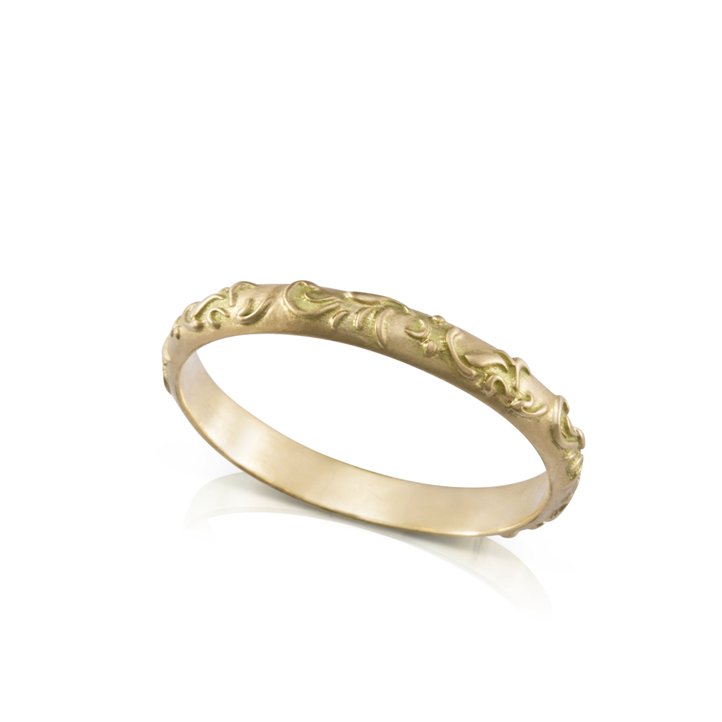 A gold ring with a prominent oriental flower decoration