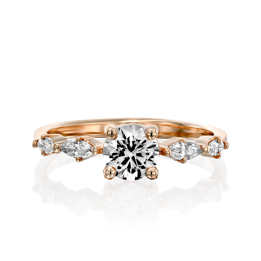 Engagement ring set with a central round lab diamond 0.60 carat and marquise lab diamonds