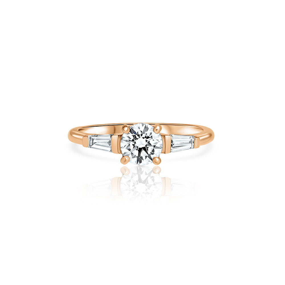 Engagement ring set with lab diamonds, a central round lab diamond, 0.70ct and two taper cut lab diamonds