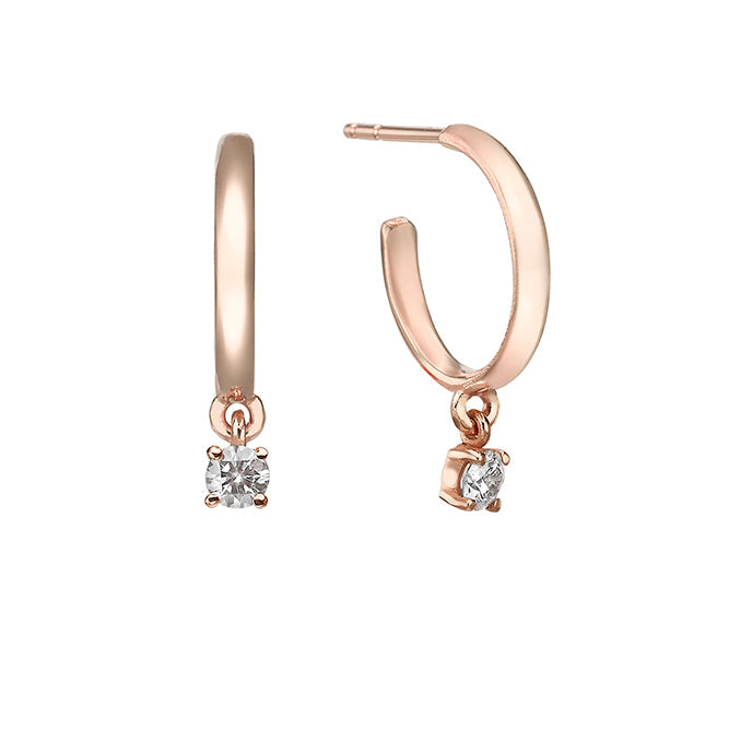 Gold hoop earrings with 20 point diamonds inlaid with teeth