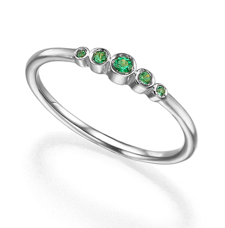 A delicate emerald ring