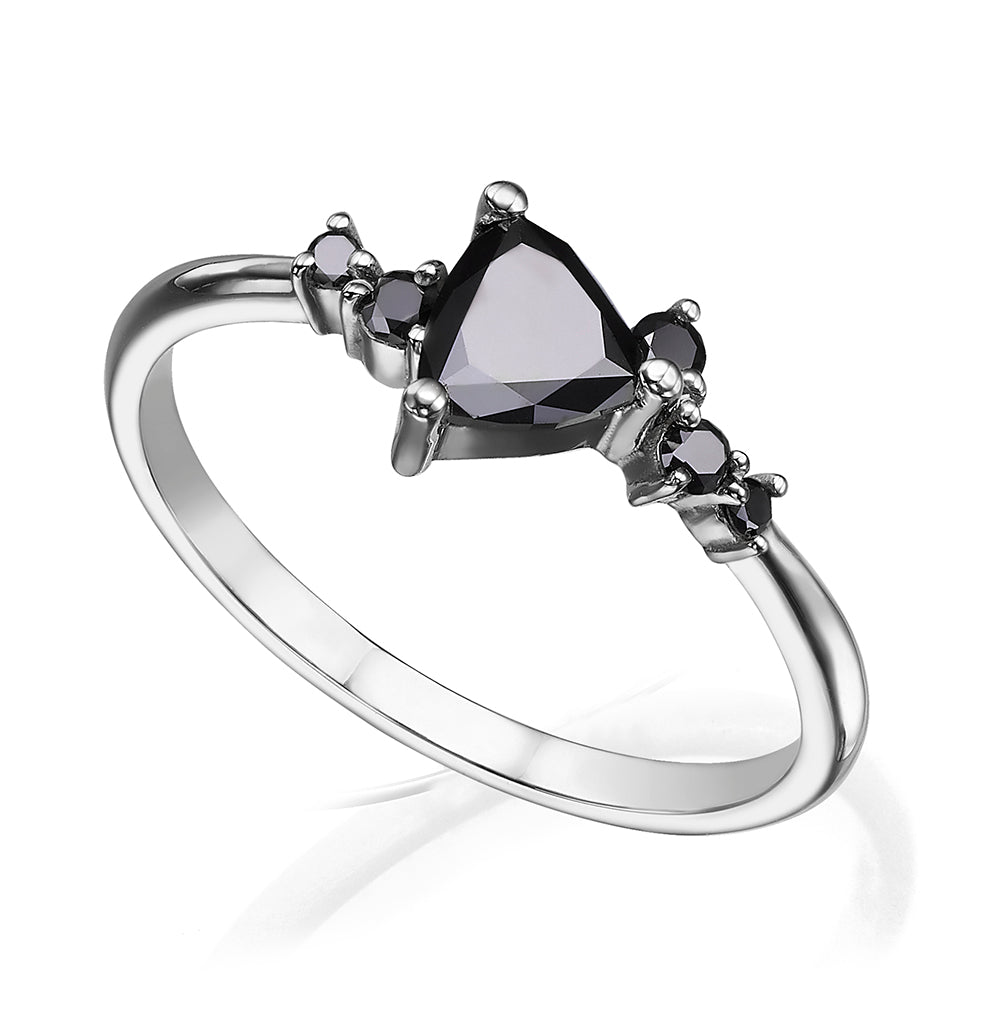 An engagement ring set with a trillion-cut black diamond and black diamonds all around