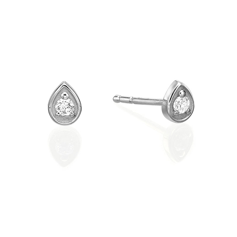 Small attached round diamond earrings in a drop frame