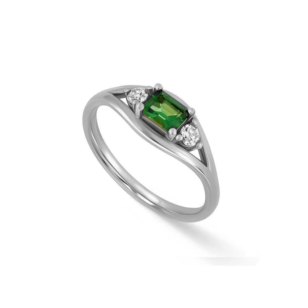 A special gold ring set with rectangular green tourmaline and white diamonds