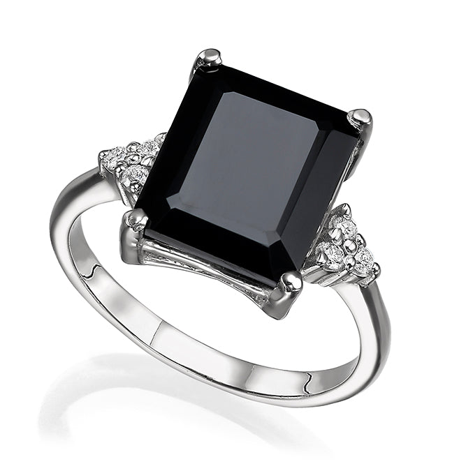 Engagement ring studded with rectangular black onyx and 6 sided diamonds
