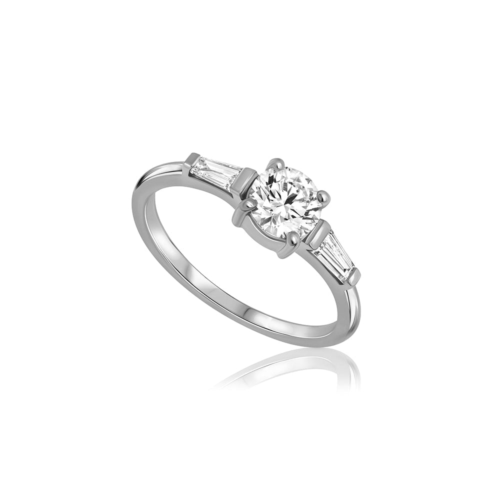 Engagement ring set with lab diamonds, a central round lab diamond, 0.70ct and two taper cut lab diamonds