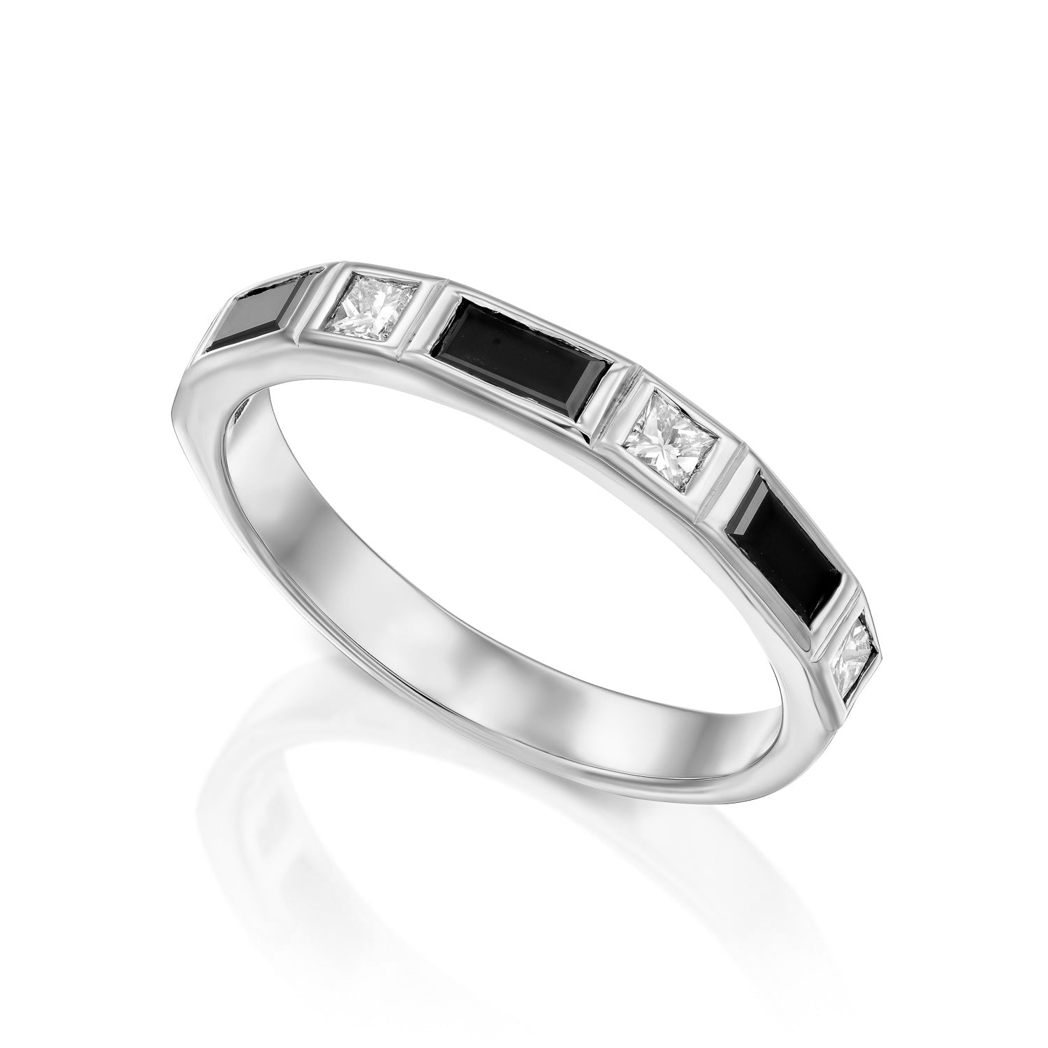 A semi-eternity ring set with baguette-cut black diamonds and princess-cut white diamonds