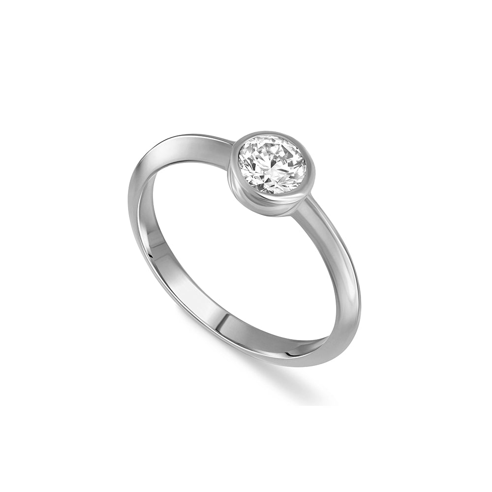 A solitaire ring set with a half carat laboratory diamond in a gold frame.