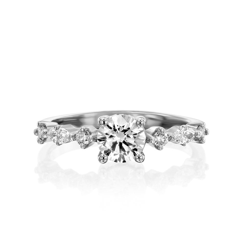 A diamond ring set with a 0.60 carat round diamond combined with marquise-cut diamonds