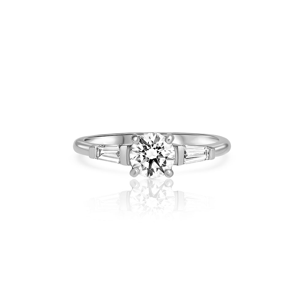 Engagement ring set with lab diamonds, a central round lab diamond, 0.70ct and two taper cut lab diamonds