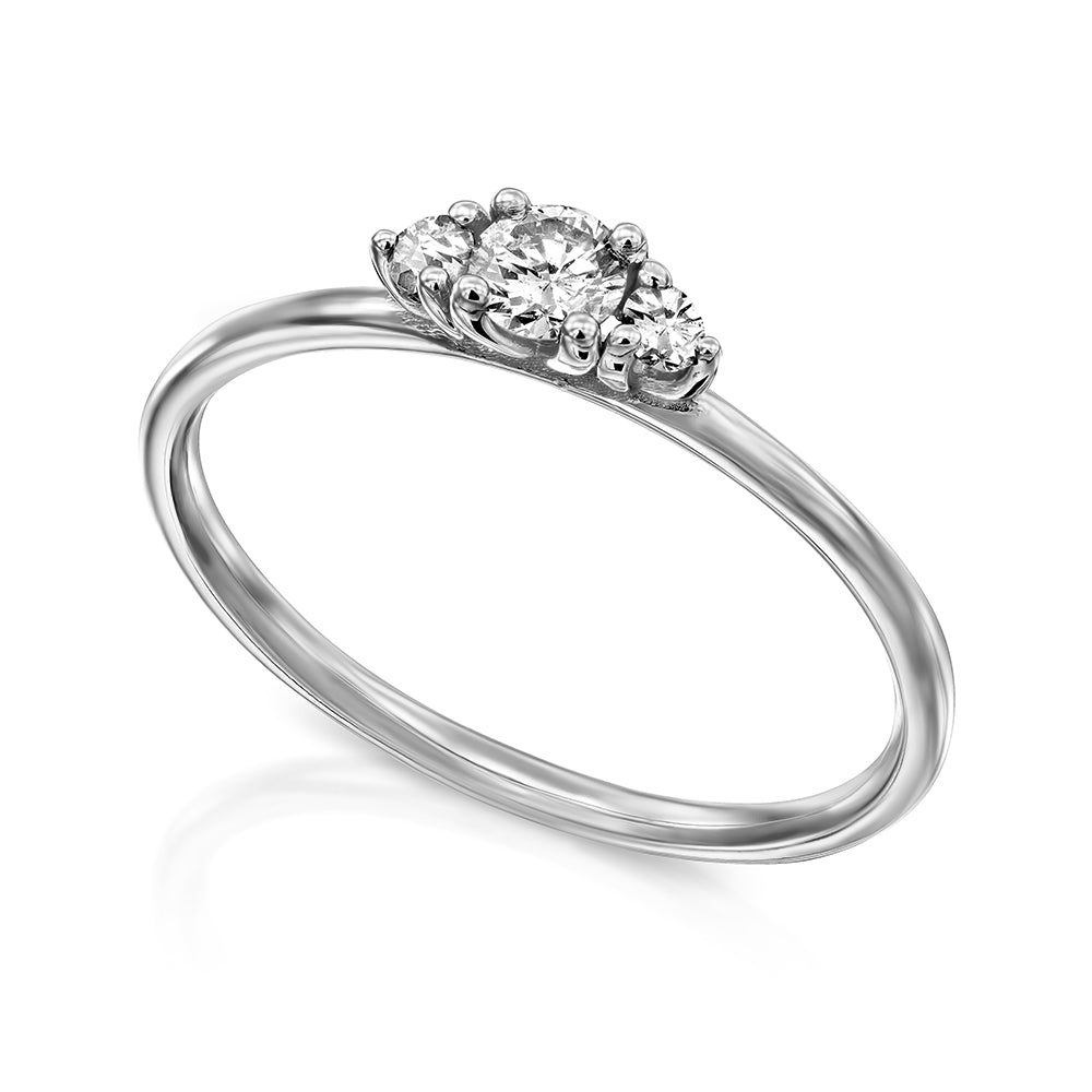 A fine gold ring set with three white laboratory diamonds