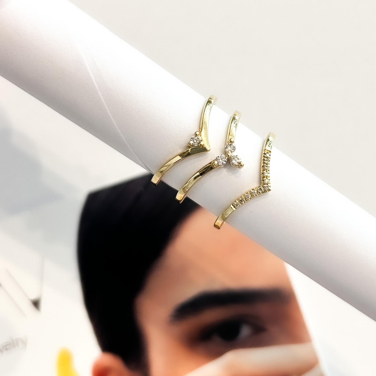 V-shaped gold ring set with 3 diamonds