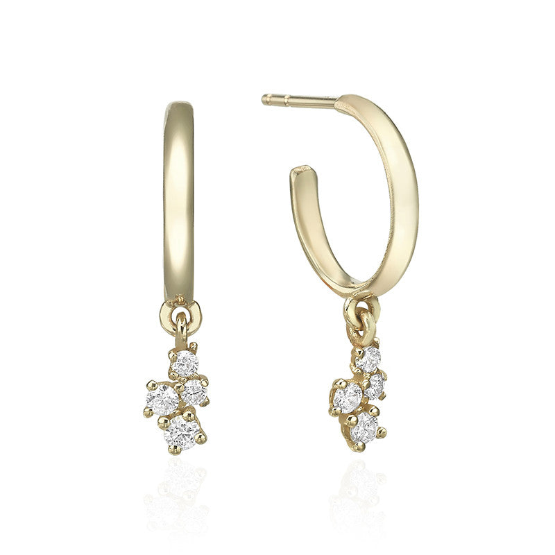 Gold hoop earrings with diamonds of varying sizes