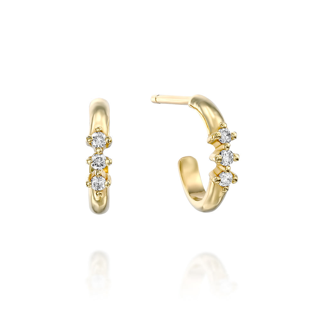 Small gold hoop earrings with a special setting of 3 white diamonds in each earring